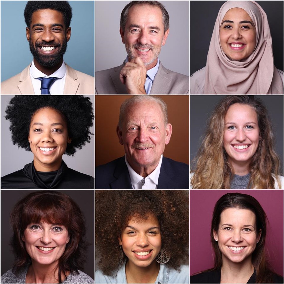 Group of 9 beautiful people in front of a background